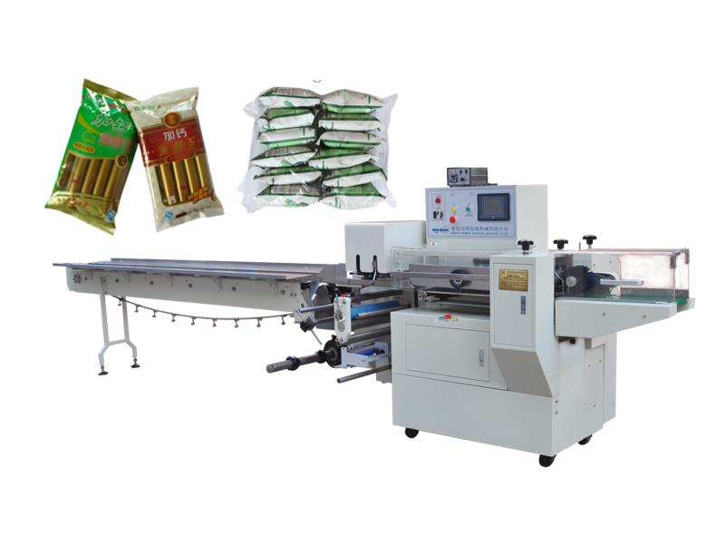 Pillow type bag flow wrapping machine